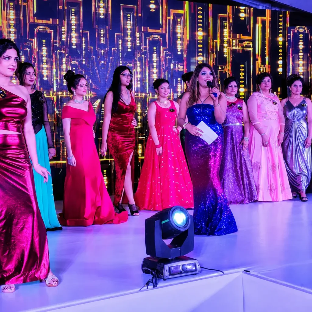 Anchor in live show with models in background